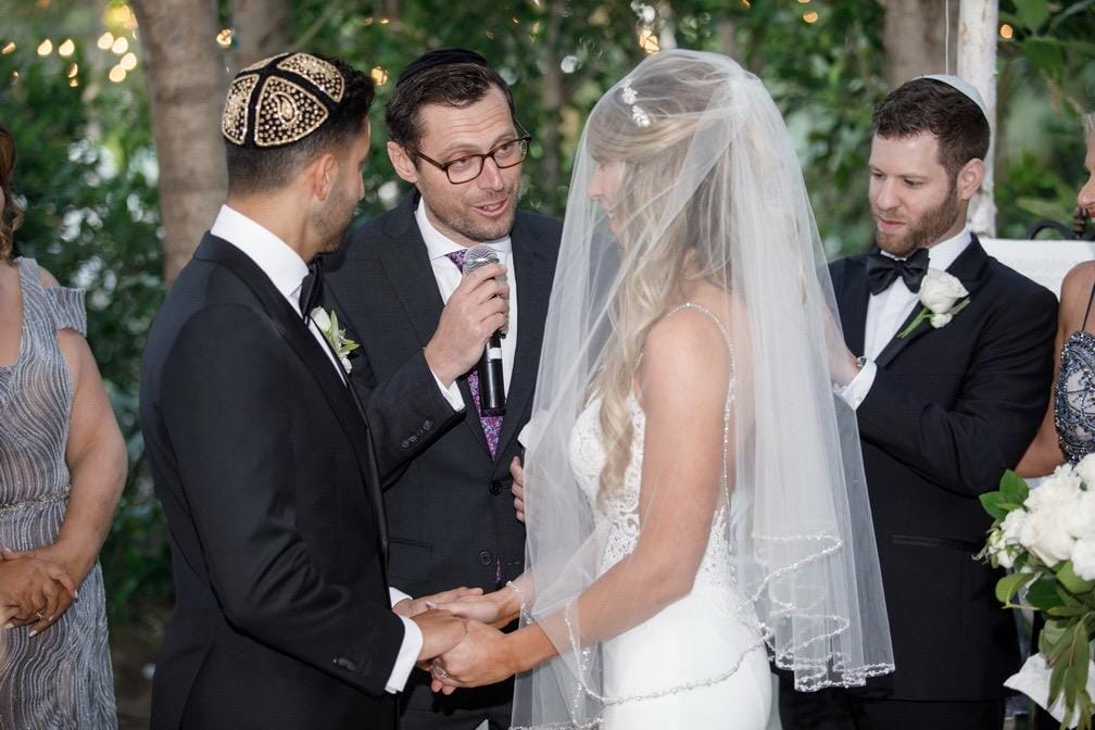 Rings, blessings, and a room full of people who love them.